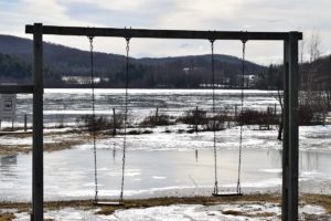 swings next to a lake