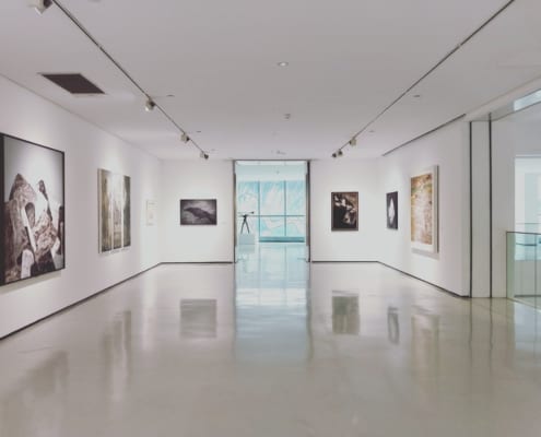 Museum hallway in Montreal with white walls and paintings