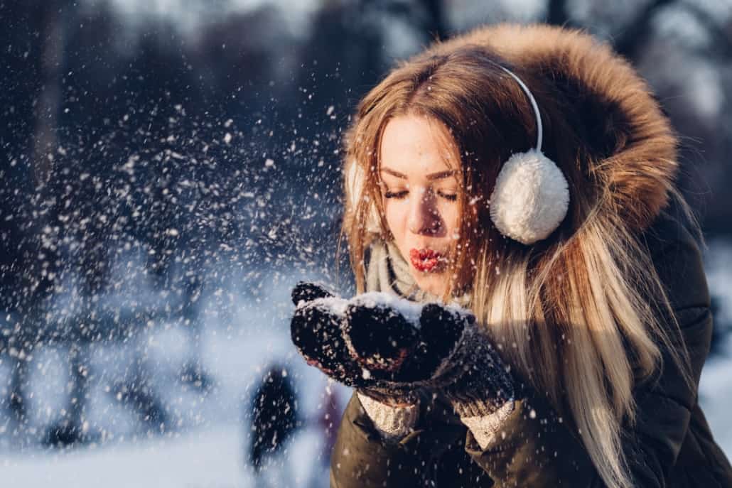 Girl Blowing snow in the wind