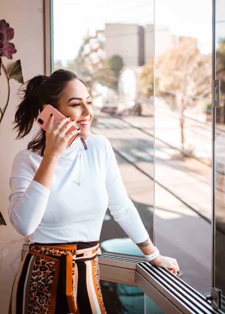Women talking on the phone in office